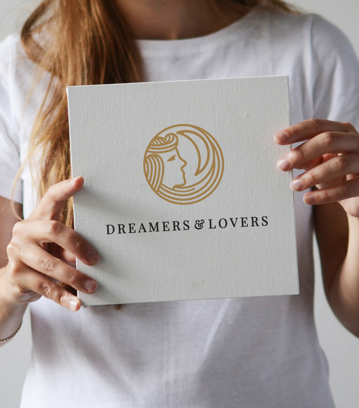 Dreamers and Lovers sign held by female model